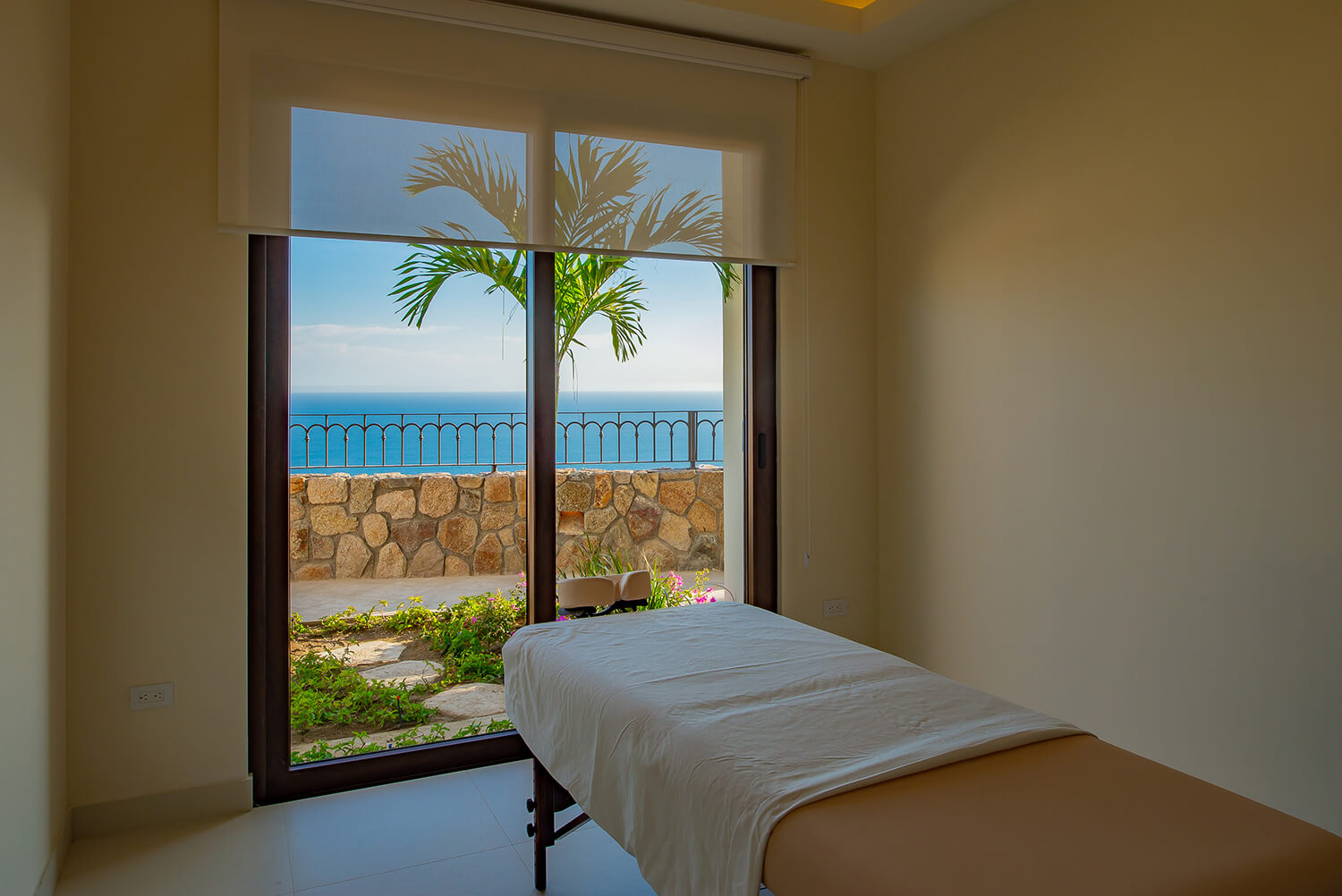 A spa treatment room looking out to the ocean
